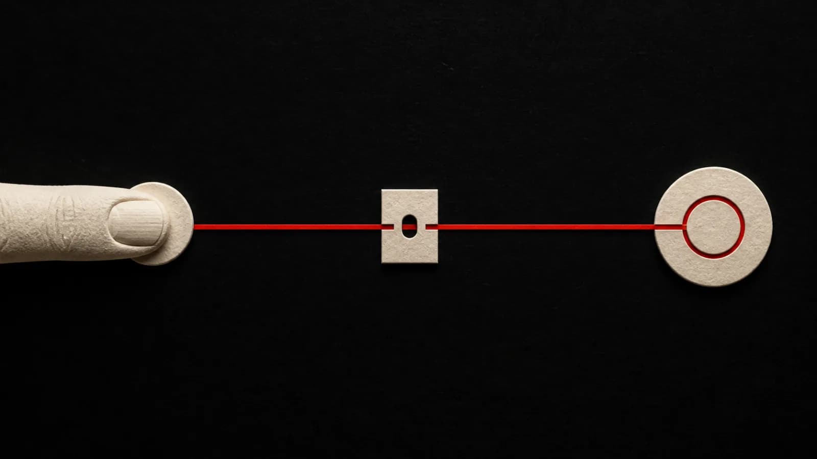 One carved ivory fingertip sends a single Signal Red path through a registration notch to one receiving mark.